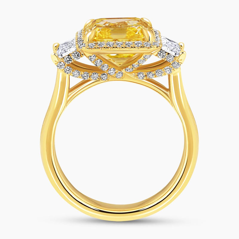 18ct yellow gold Fancy Vivid Yellow asscher cut diamond ring with baguette and round brilliant cut diamonds side profile