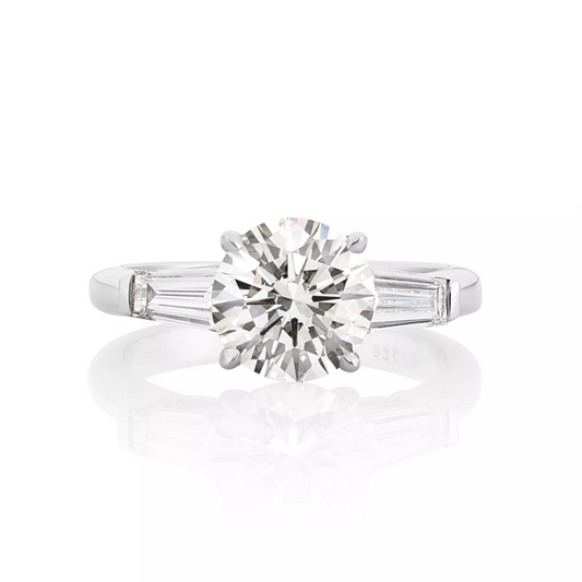 18ct white gold round brilliant and tapered baguette trilogy ring