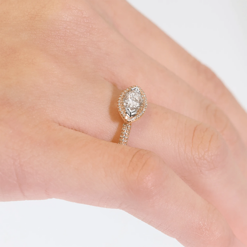 18ct rose and white gold Argyle marquise diamond engagement ring on the finger