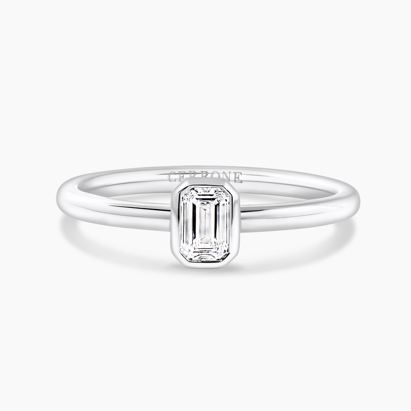 18ct white gold bezel set emerald cut diamond solitaire ring