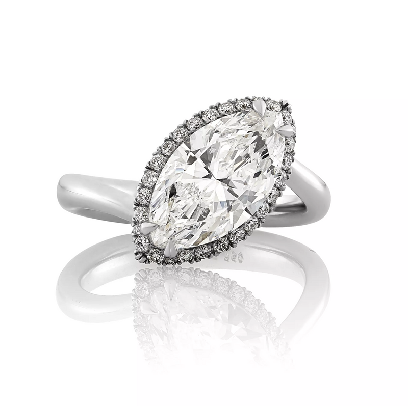 18ct white gold marquise and round brililant cut halo ring