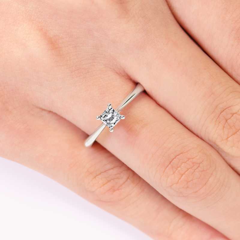 18ct white gold 0.35ct radiant cut diamond solitaire ring on finger