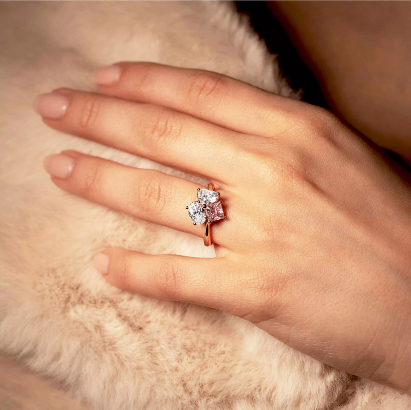 18ct rose gold Argyle princess cut pink diamond, oval and heart shaped white diamond ring on finger