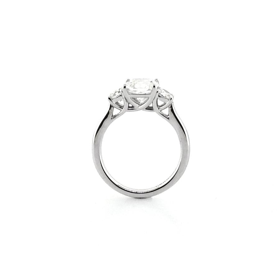18ct white gold cushion and round brilliant cut trilogy ring