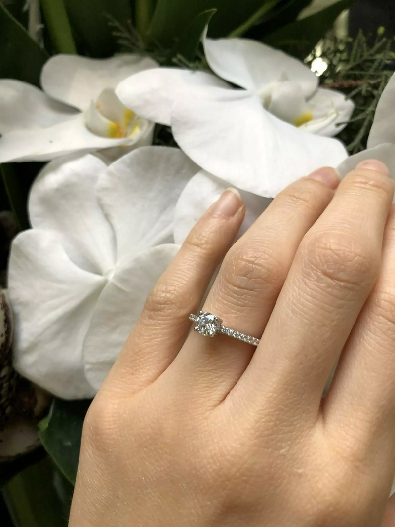 18ct white gold round brilliant cut diamond ring on finger