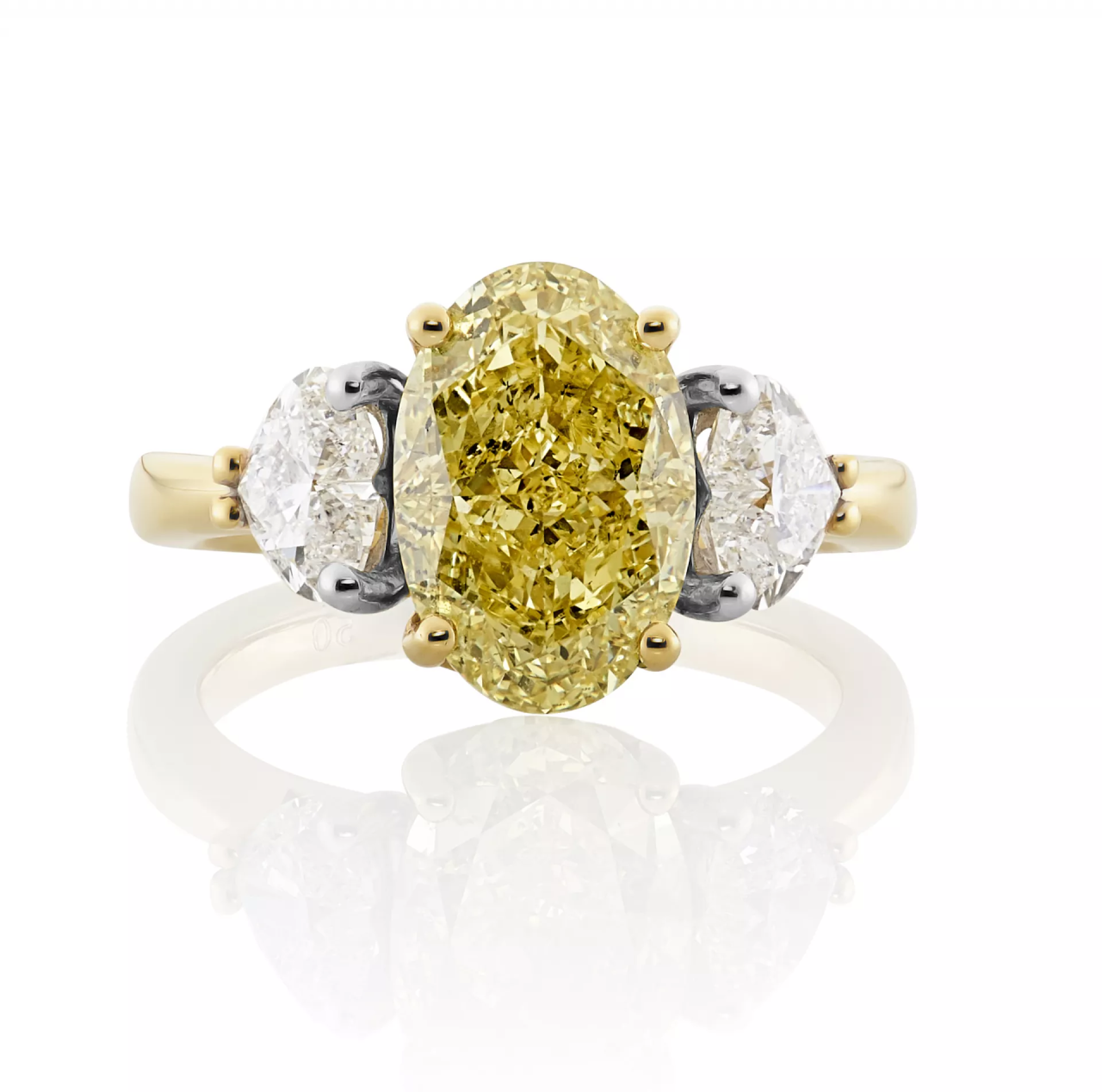 18ct yellow and white gold fancy intense yellow oval heart cut diamond trilogy ring
