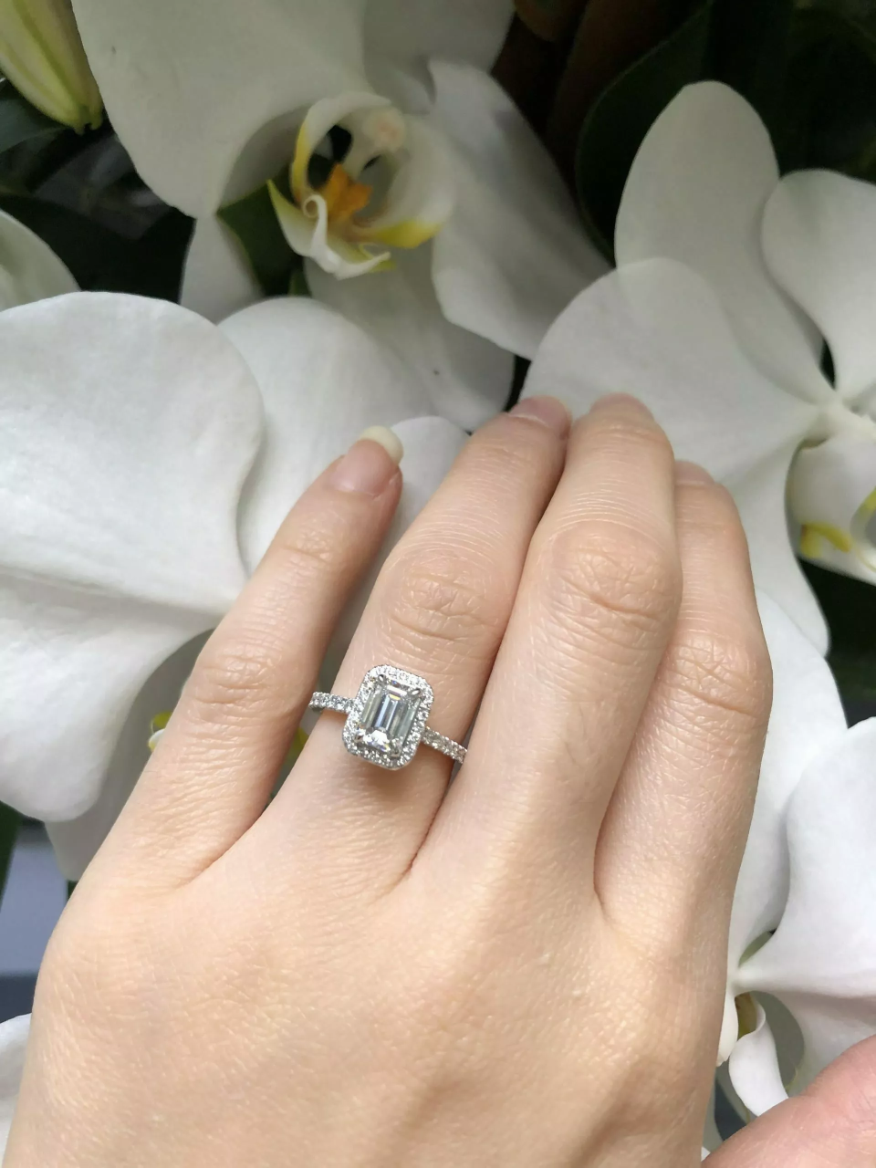 18ct white gold emerald and round brilliant cut diamond halo ring