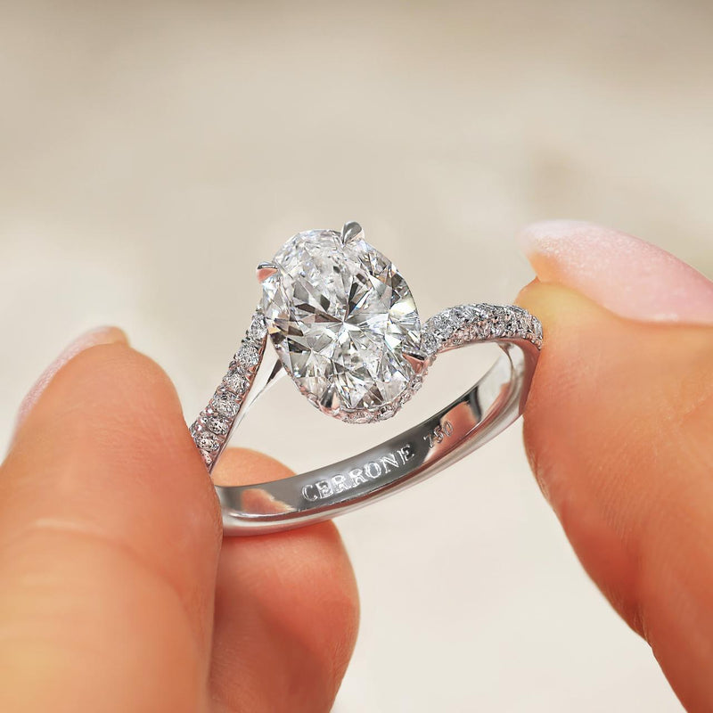 18ct white gold oval and round brilliant cut pave set diamond twist ring