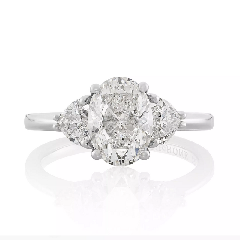 18ct white gold oval and heart shaped diamond trilogy ring