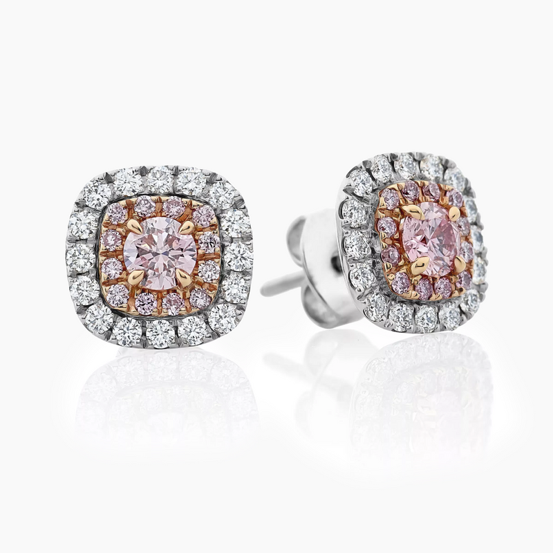 A pair of 18ct white and rose gold round brilliant cut pink and white diamond stud earrings.