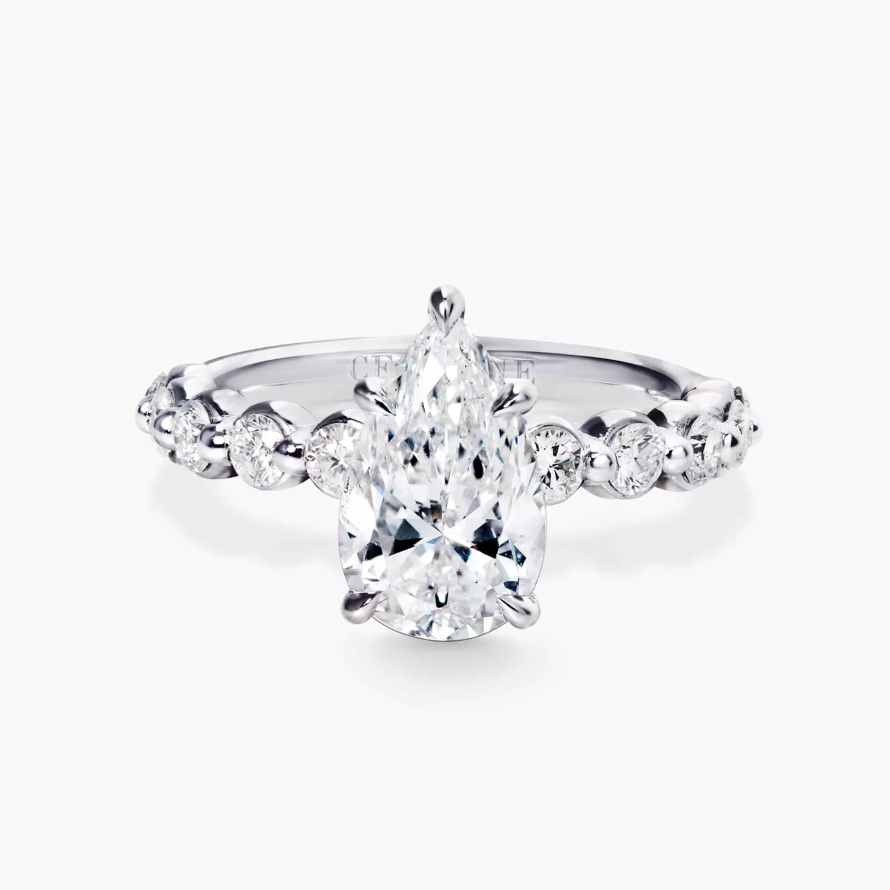 18ct white gold pear and round brilliant cut diamond ring