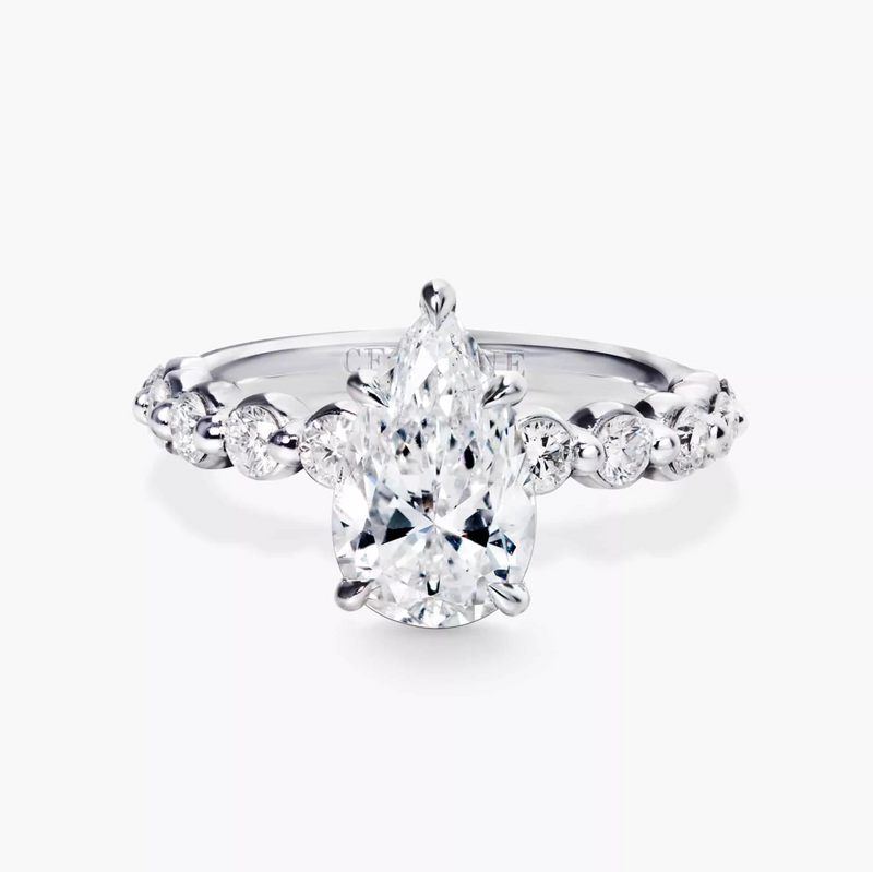 18ct white gold pear and round brilliant cut diamond ring