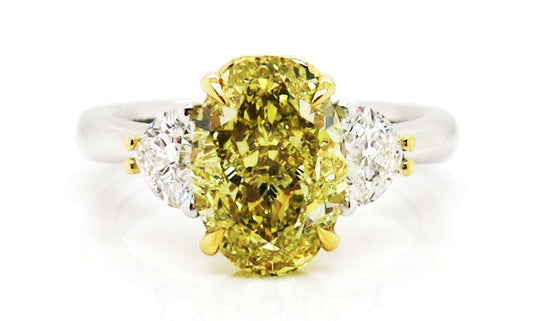18ct yellow and white gold fancy yellow oval and heart shaped diamond trilogy ring