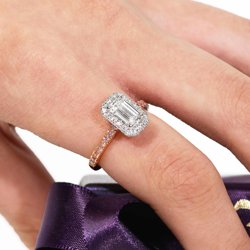 18ct rose and white gold pink and white diamond halo ring on finger