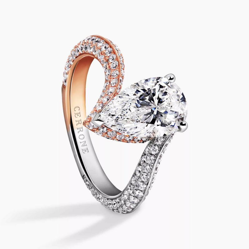 18ct white and rose gold pear and round brilliant cut diamond knife edge ring side profile