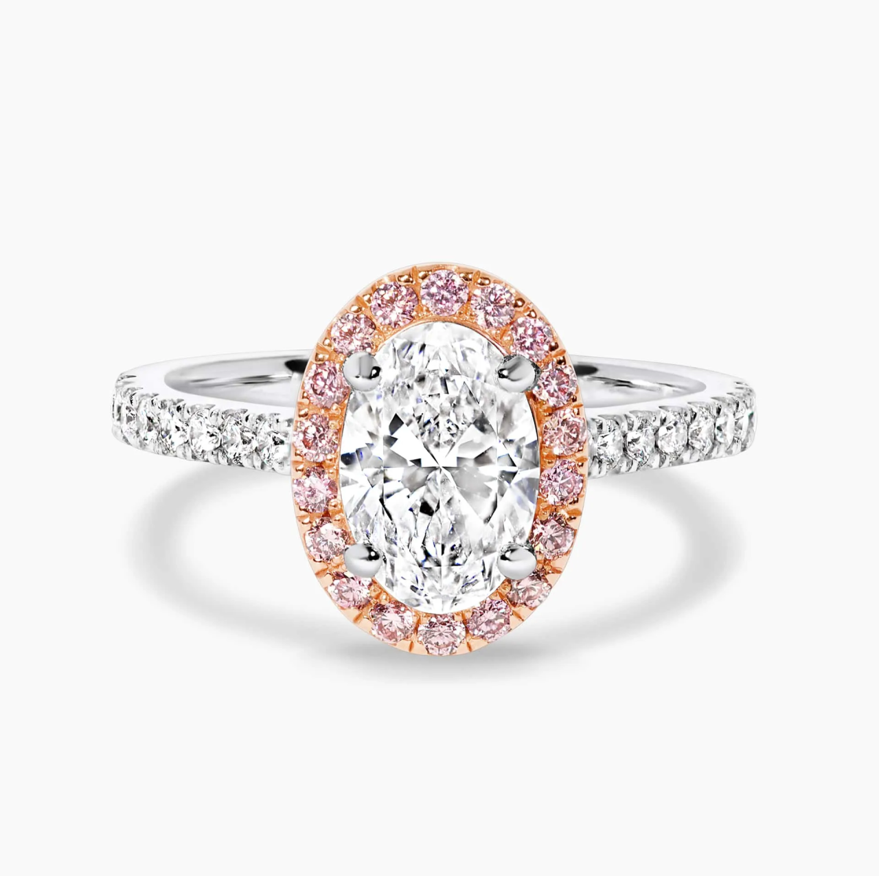 18ct rose and white gold oval and round brilliant cut diamond halo ring