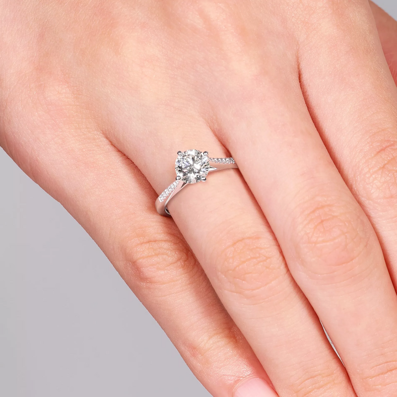18ct white gold round brilliant cut diamond ring on finger
