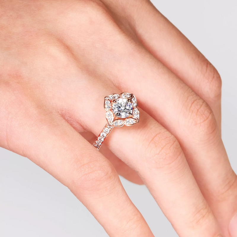 18ct rose gold round brilliant cut filagree halo diamond ring on finger