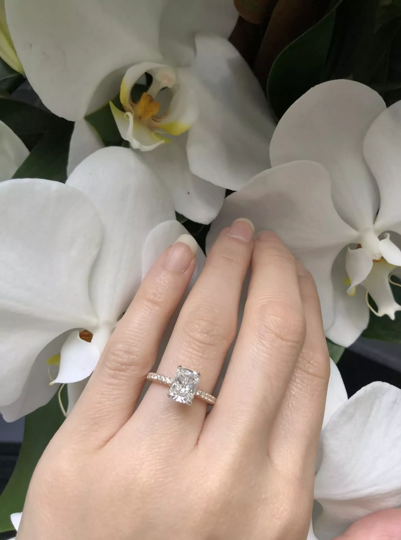 18ct rose and white going radiant and round brilliant cut pave set diamond ring on finger