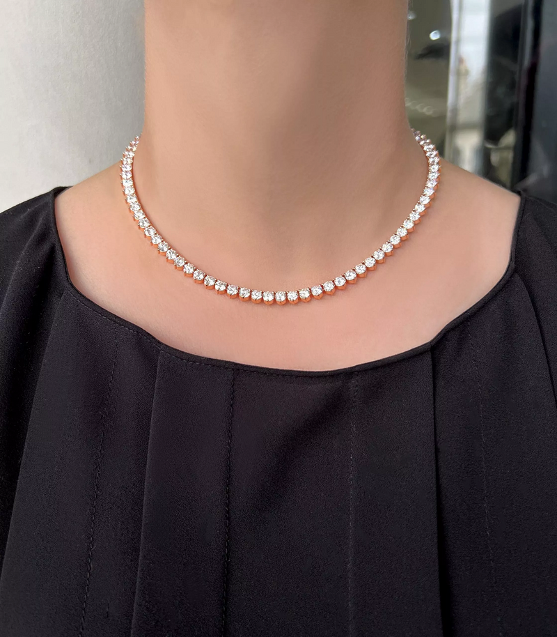 18ct rose gold three claw round brilliant cut diamond tennis necklace on the neck