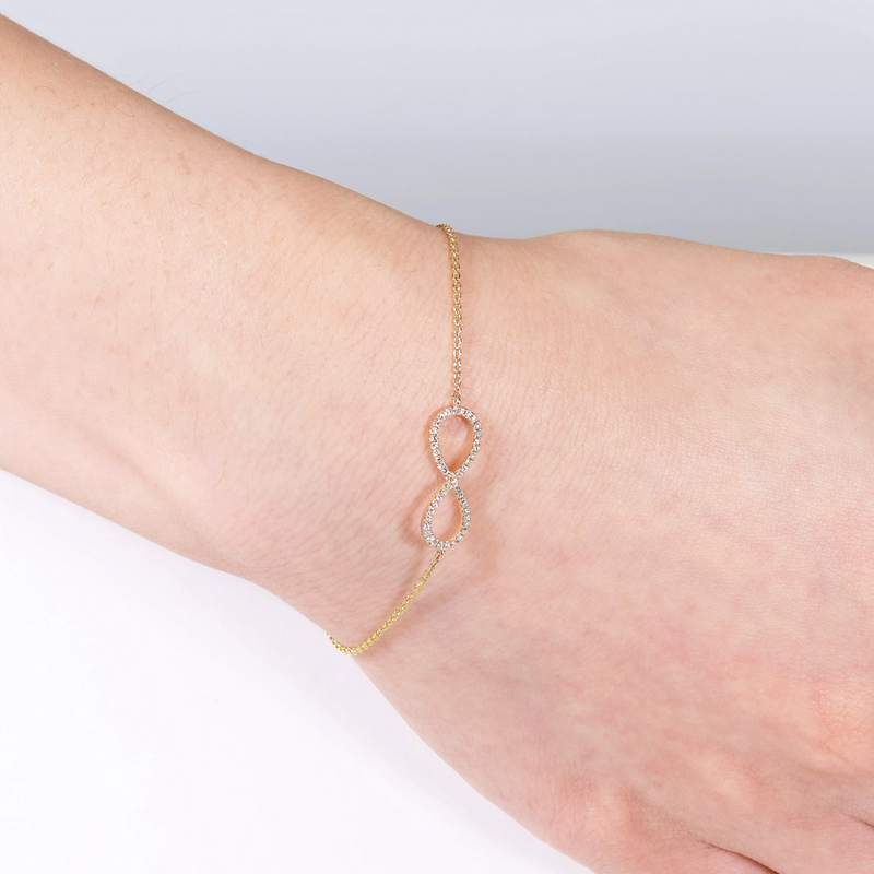 18ct yellow gold diamond infinity bracelet on the wrist