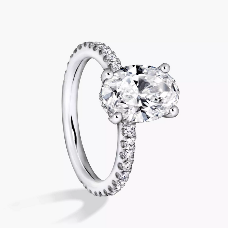 18ct white gold oval brilliant cut lab grown diamond with claw set natural diamond hidden halo and band ring side profile