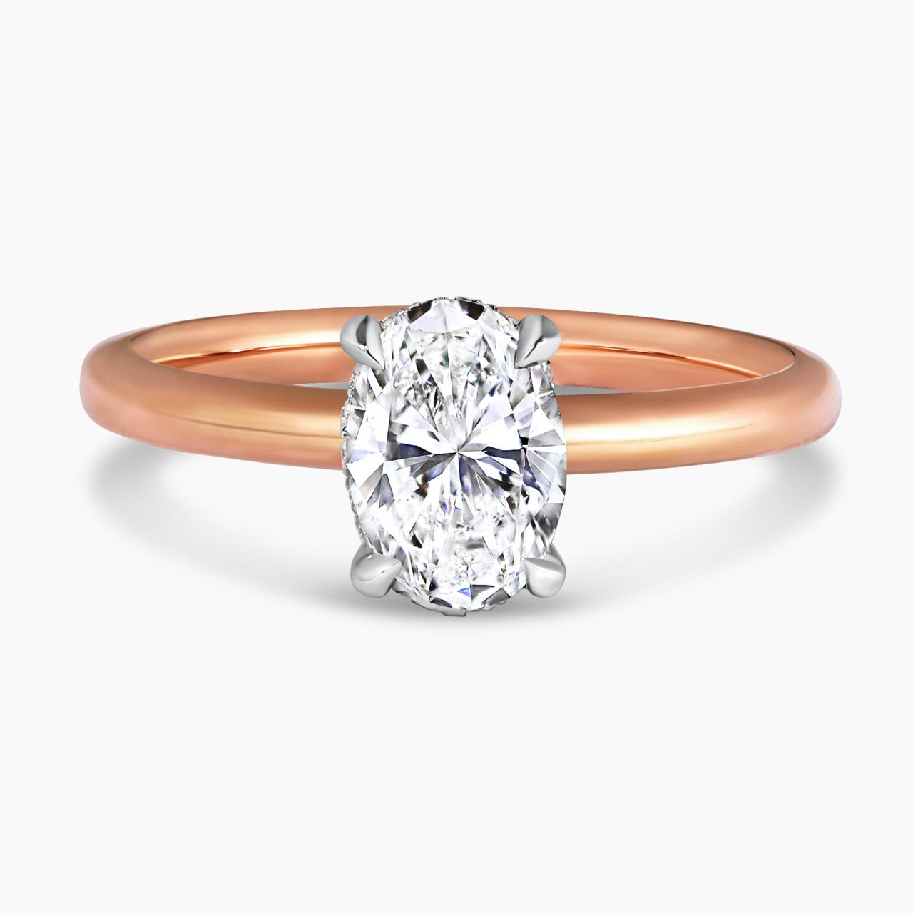 POSITANO DIA - 18ct rose and white gold oval brilliant cut diamond with round brilliant cut diamond hidden halo and pinched band ring.