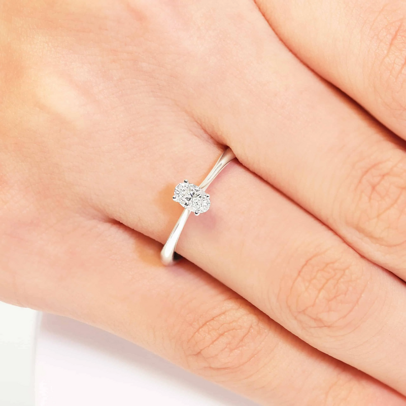 18ct white gold oval diamond solitaire ring on finger