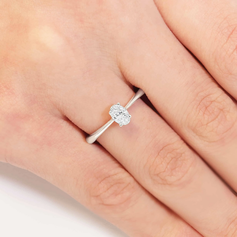 18ct white gold oval diamond solitaire ring on finger
