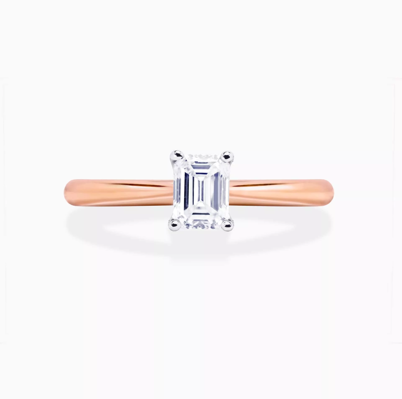 PUGLIA - 18ct rose and white gold emerald cut diamond cross over underail ring.