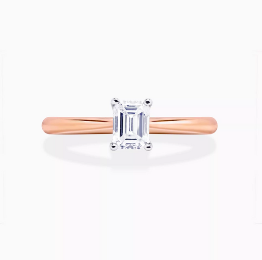 PUGLIA - 18ct rose and white gold emerald cut diamond cross over underail ring.