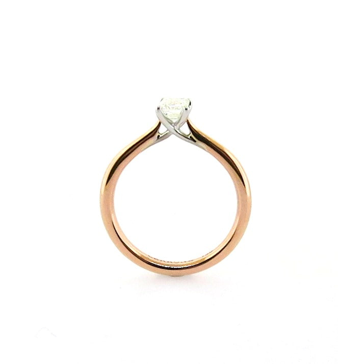 PUGLIA - 18ct rose and white gold emerald cut diamond cross over underail ring.