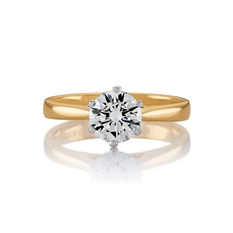 18ct Yellow and White Gold round brilliant cut diamond six claw upswept ring