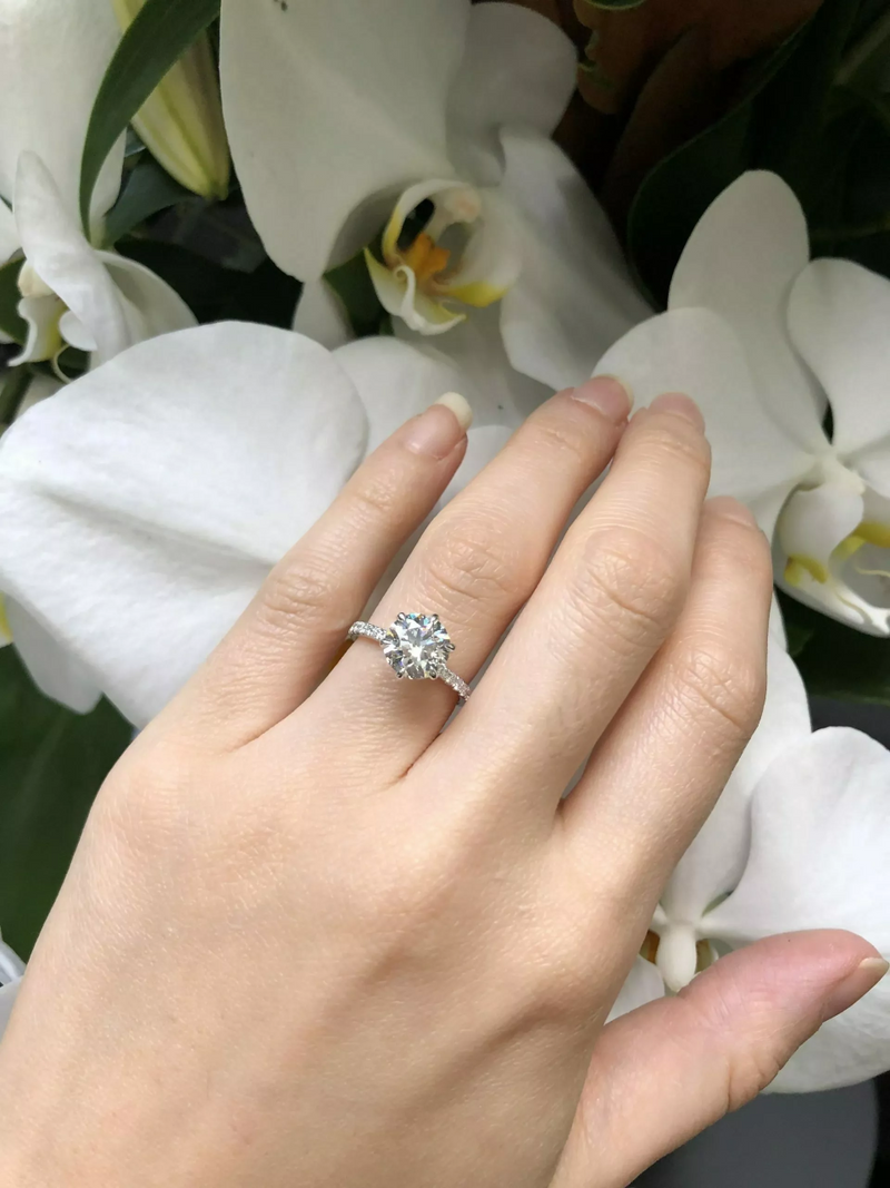18ct white gold round brilliant cut diamond six claw diamond ring on finger