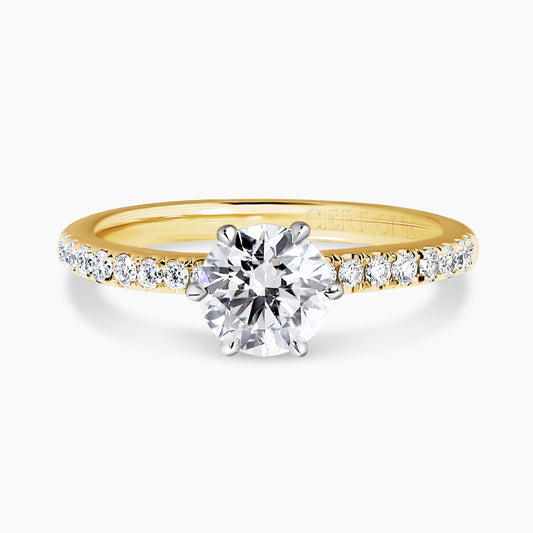 CAPRI DIA BAND - 18ct yellow and white gold round brilliant cut diamond ring in a six claw setting with diamond band