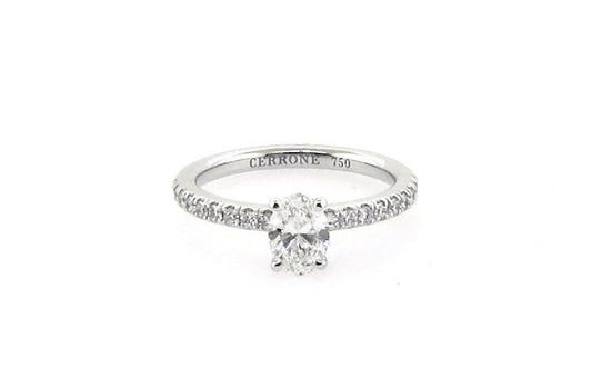 18ct white gold oval and round brilliant cut diamond ring