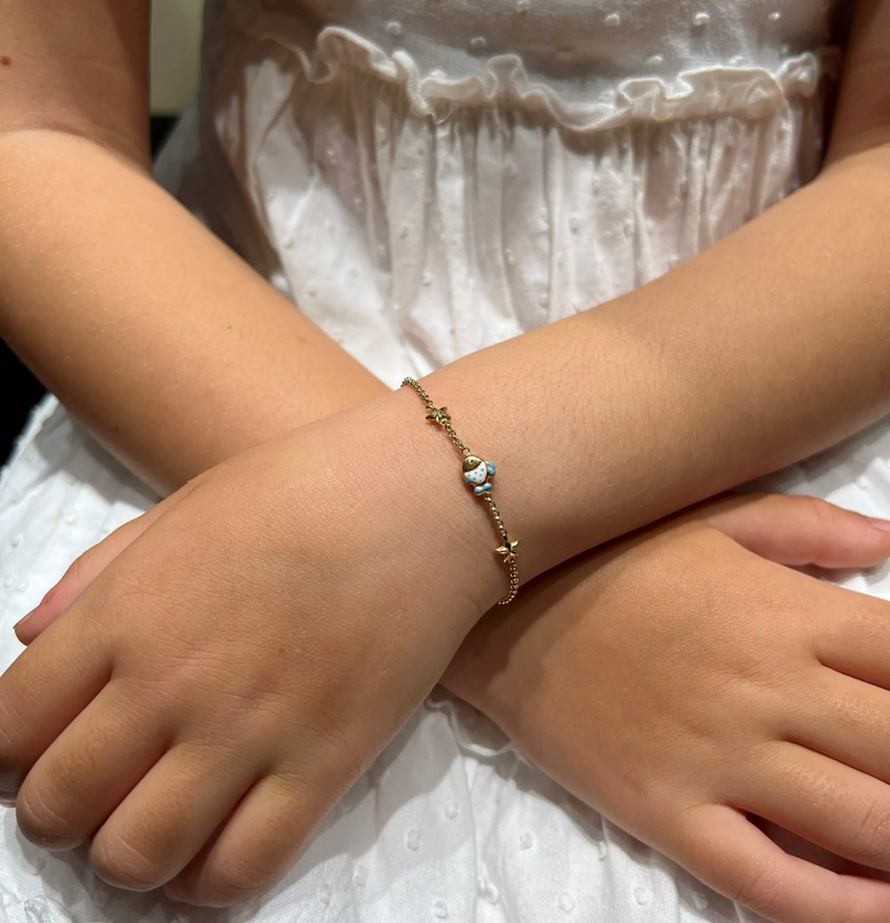 18ct yellow gold fish enamel bracelet on wrist