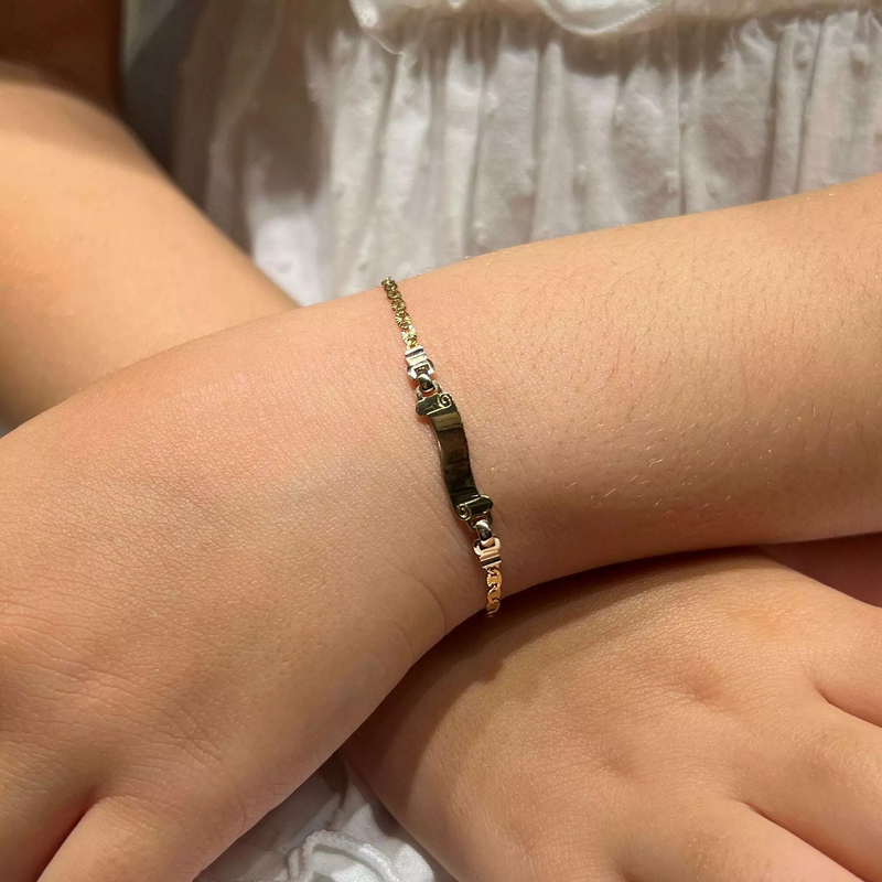 18ct White & Yellow Gold Baby ID Bracelet on child's wrist