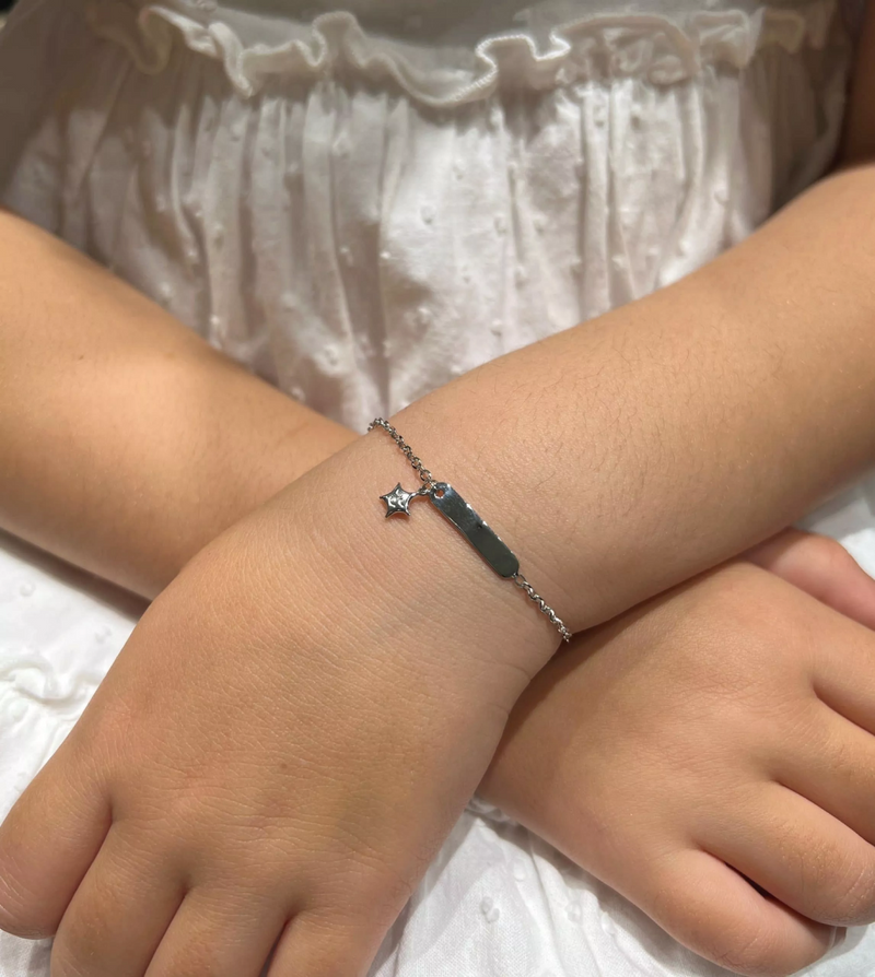 18ct White Gold Baby ID Star Bracelet on the wrist