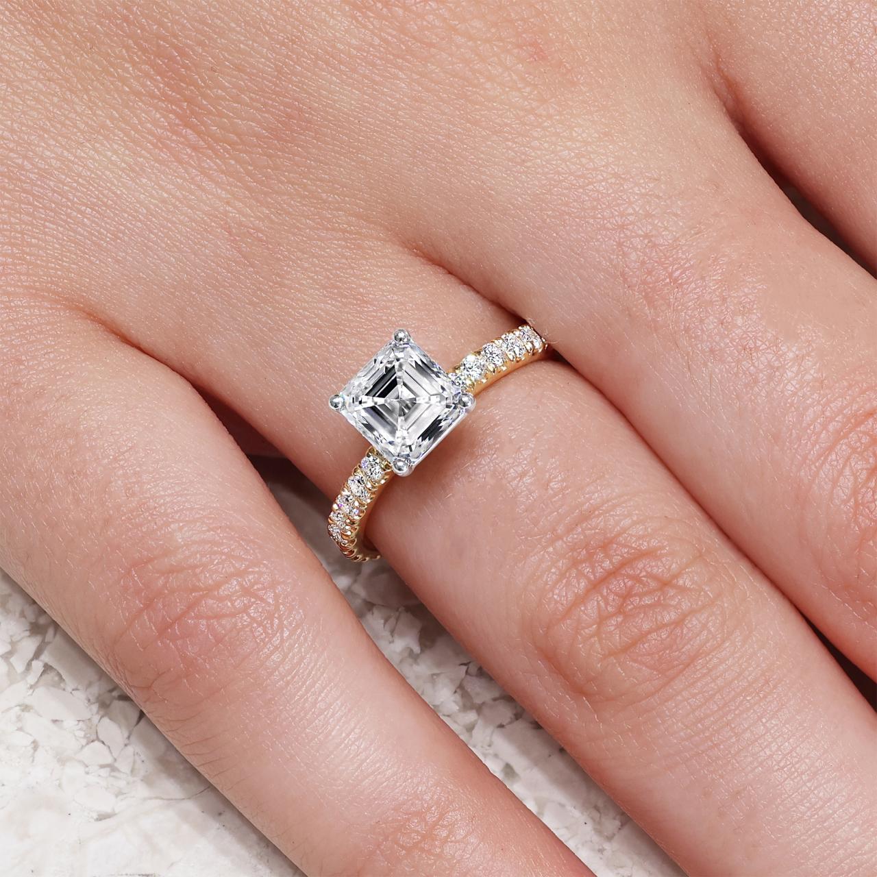 18ct yellow and white gold 2.07ct Asscher cut LAB Grown Diamond ring on finger