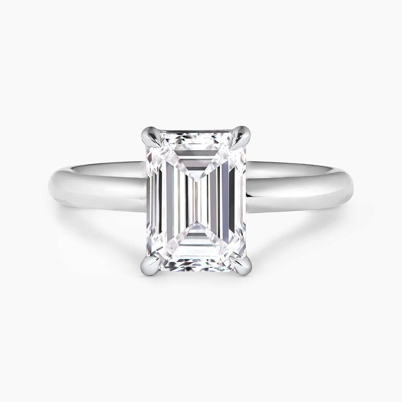 18ct white gold emerald cut diamond solitaire engagement ring in a four claw setting