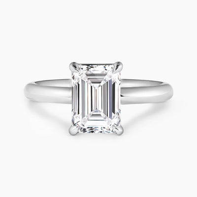 18ct white gold emerald cut diamond solitaire engagement ring in a four claw setting