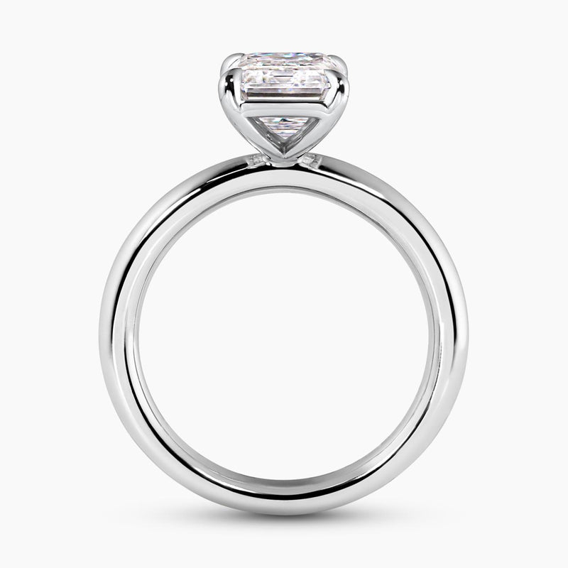 18ct white gold emerald cut diamond solitaire engagement ring in a four claw setting side profile