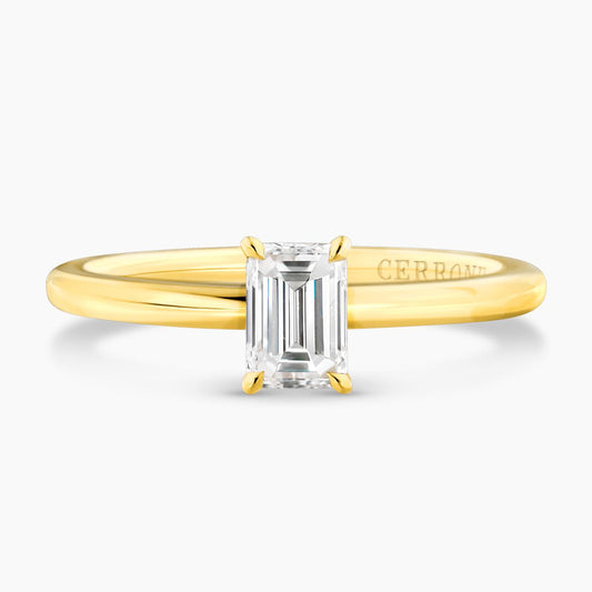 18ct yellow gold 0.50ct emerald cut solitaire ring in a four claw setting