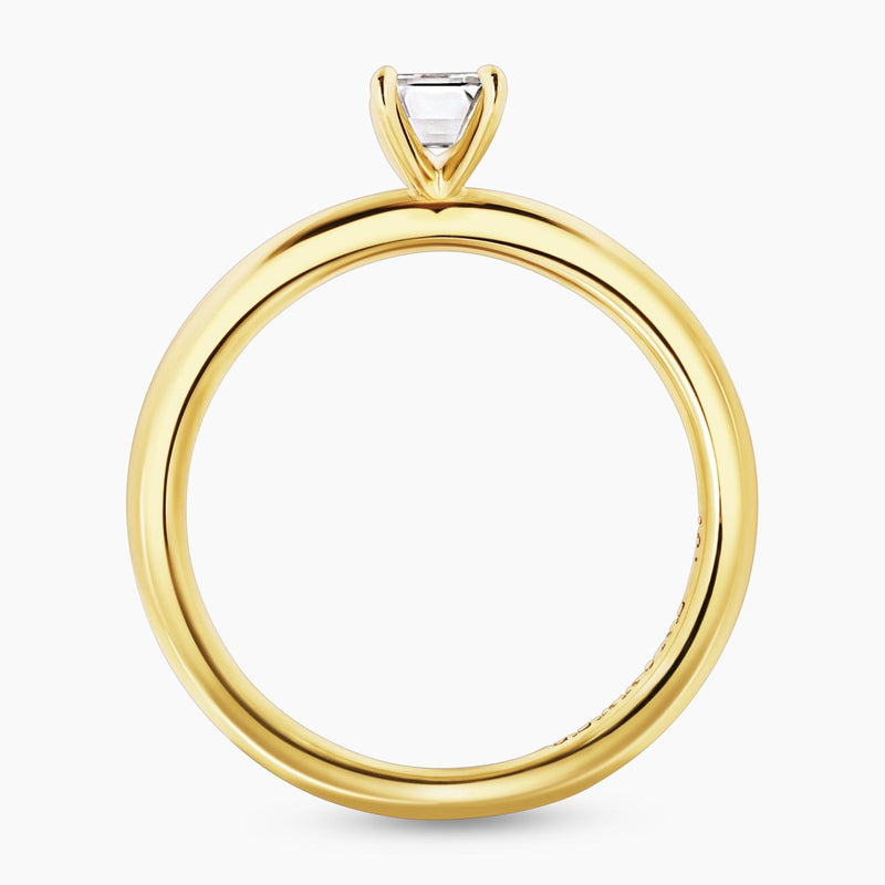 18ct yellow gold 0.50ct emerald cut solitaire ring in a four claw setting side profile
