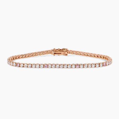 An 18ct rose gold tennis bracelet with argyle pink and round brilliant cut diamonds in a four claw setting.