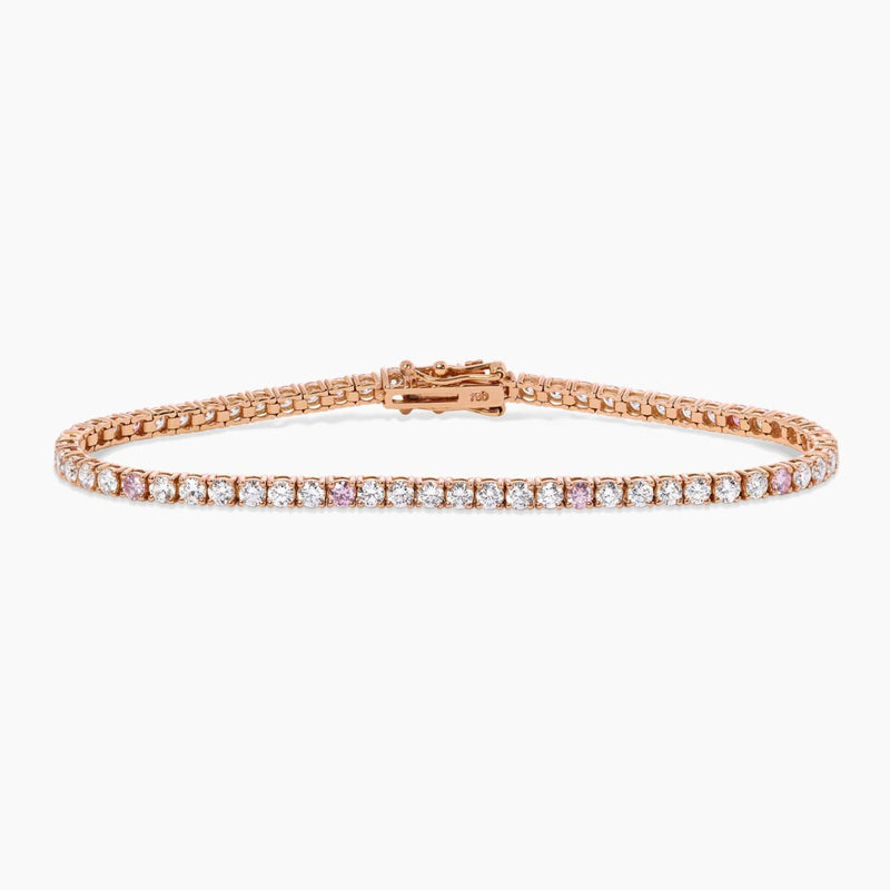An 18ct rose gold tennis bracelet with argyle pink and round brilliant cut diamonds in a four claw setting.