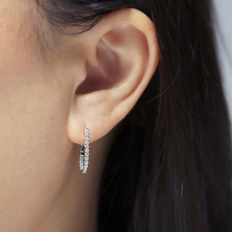 18ct white gold diamond claw set pear shape small hoop earrings on the ear