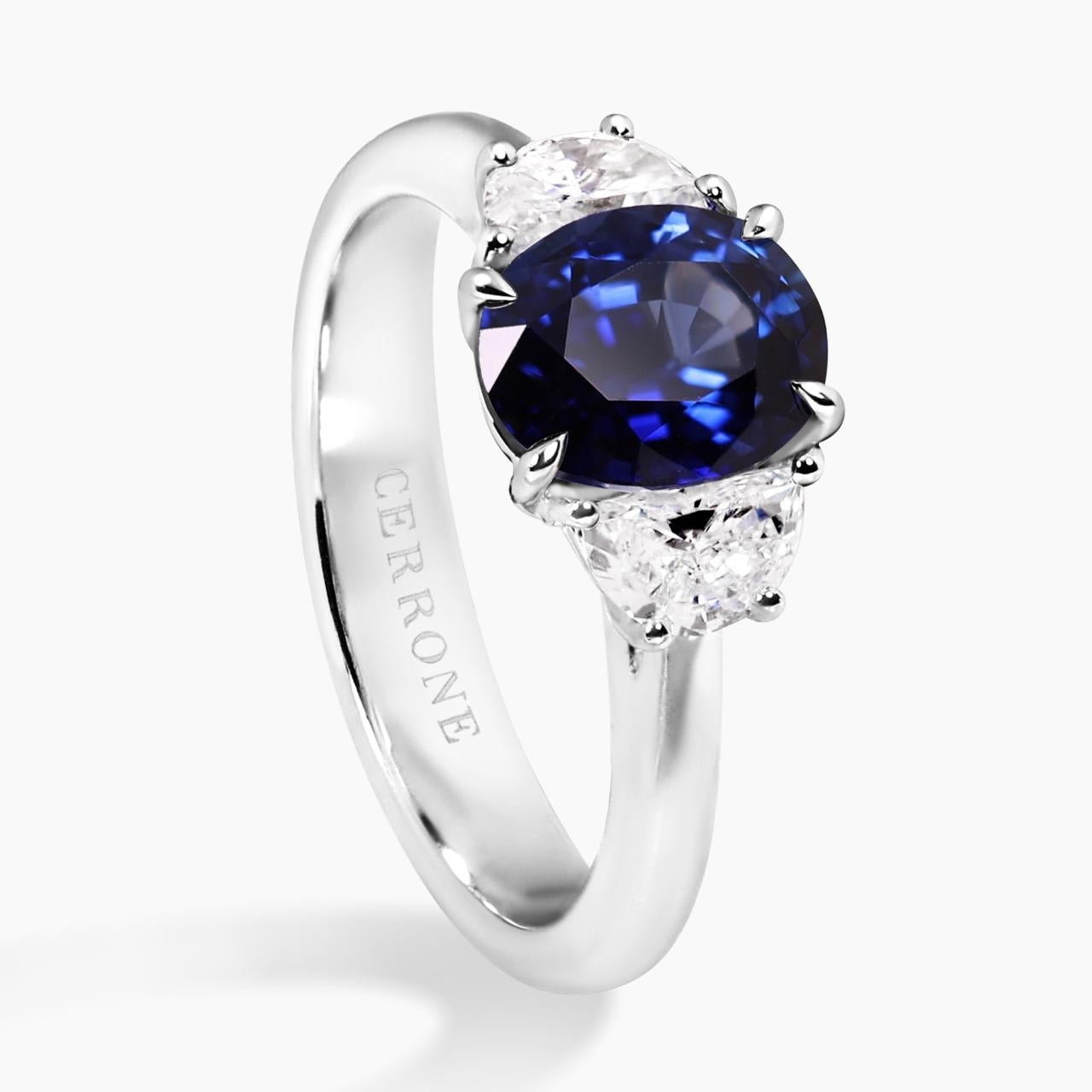 Platinum oval brilliant royal blue sapphire and diamond ring side angle