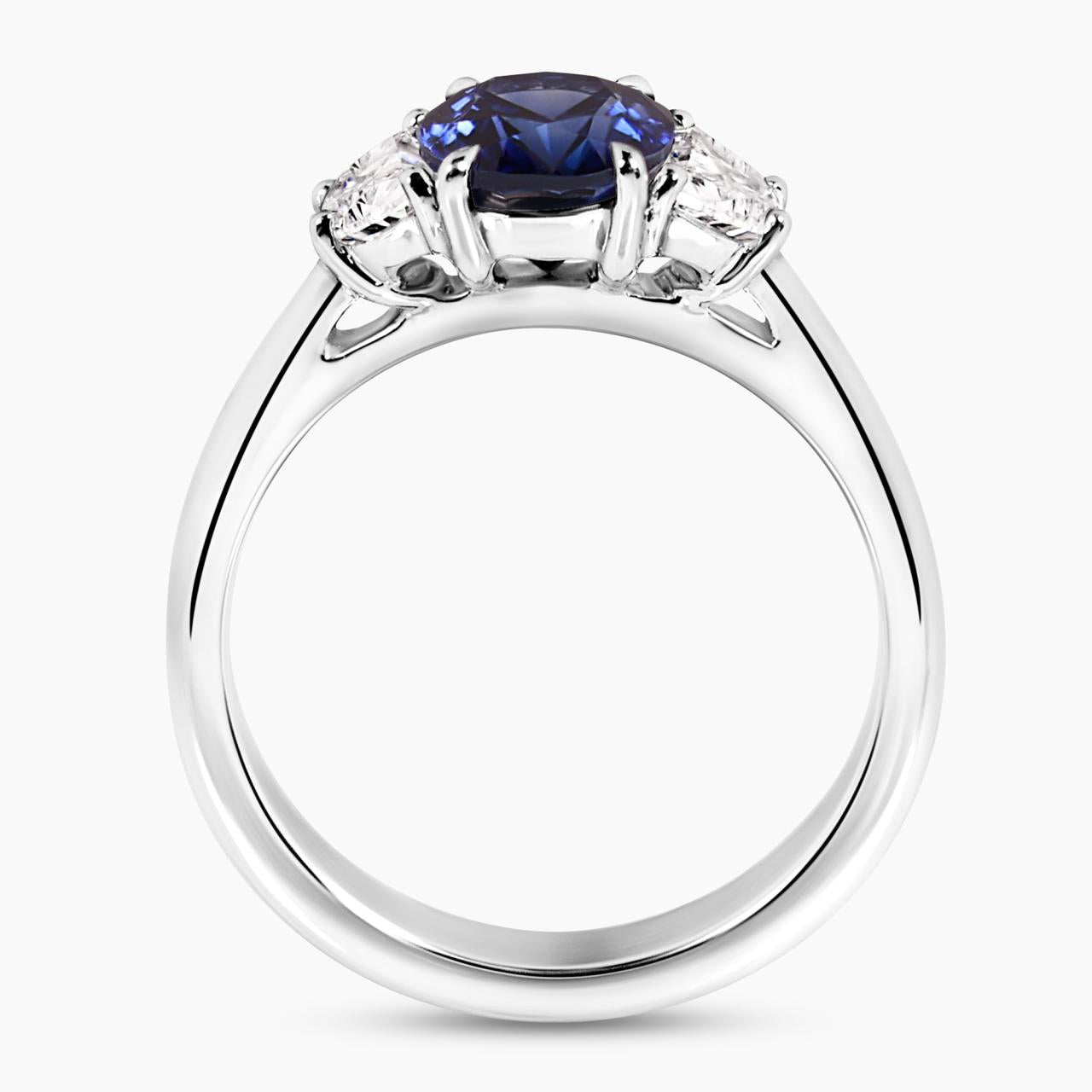 Platinum oval brilliant royal blue sapphire and diamond ring side view